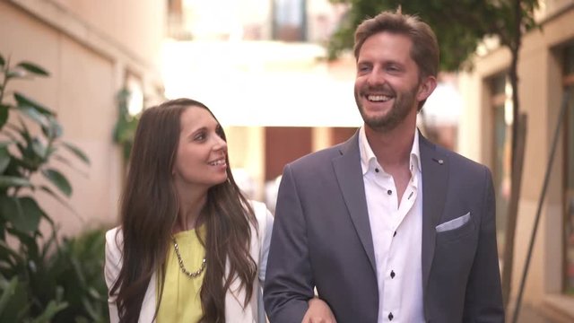 4k footage, well dressed young couple talking and walking on their sightseeing trip
