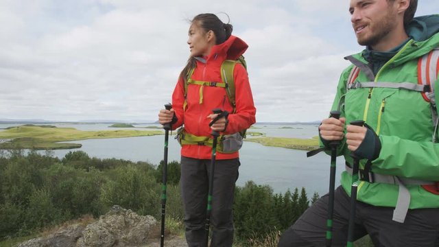 Hikers enjoying view of nature during hiking trek. People on hike in beautiful landscape living healthy active lifestyle. Couple on travel in Lake Myvatn, north Iceland. RED EPIC.