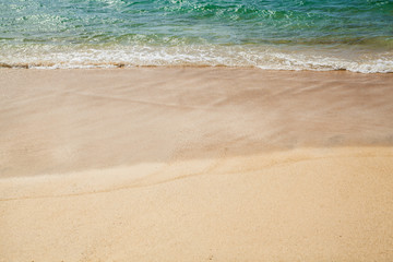 Sea wave on the sand beach