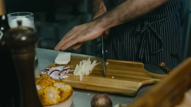 Restaurant Chef preparing ingredients for a salad. 60 FPS slow motion shot. Blackmagic URSA Mini