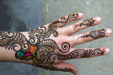 henna painted hand decorations - Hand recently painted with Henna