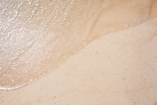 Sea wave on the sand
