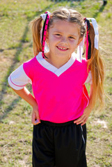 Portrait of young soccer girl on the field during a game.