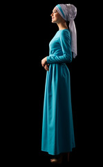 Naklejka premium Young muslim woman in blue dress