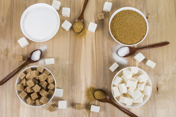 Cane and white sugar in a white bowls