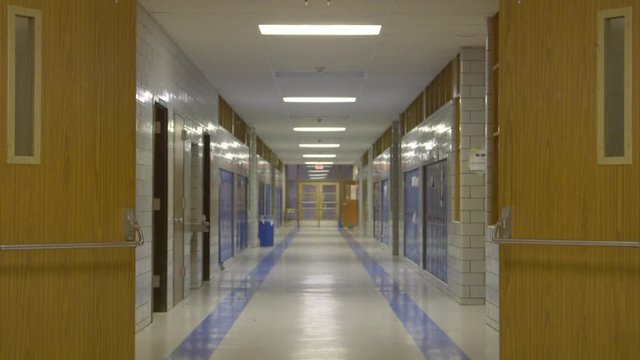 Rack focus shot of an empty school hallway