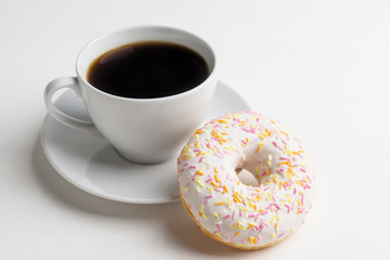 Donut with sprinkles on the white background