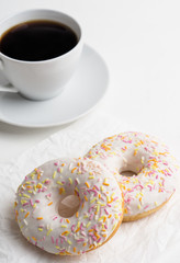 Donut with sprinkles on the white background