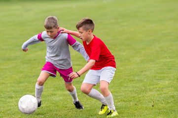  Boys kicking ball