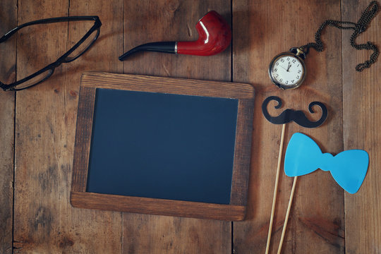 blank blackboard and composition of man's accessories