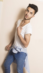 Studio shot of Brunette guy isolated inside studio