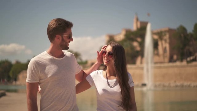 couple in love walking through small road
