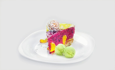 Piece of a raw vegan various fruits and berries cake with a coco