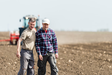 father and son working in agriculture