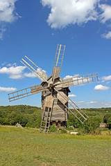 Fototapeta na wymiar Windmill in the village, Pirogovo, Ukraine