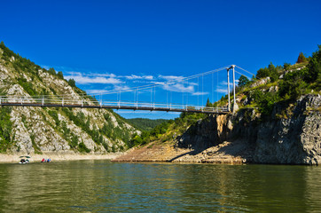 Landscape with pedestrian bridge at river Uvac gorge, southwest Serbia