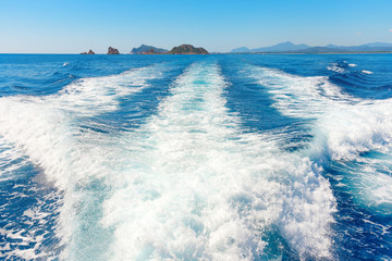 Waves on blue sea behind the boat