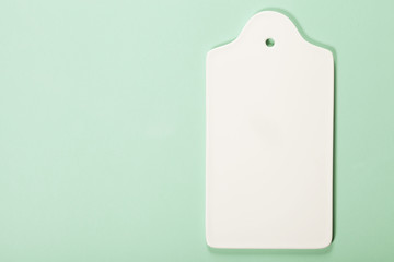 White ceramic serving board over light blue background
