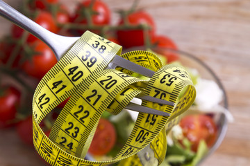 salad and fork with tape measure