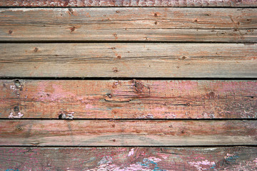 Rustic weathered barn wood background painted in red color