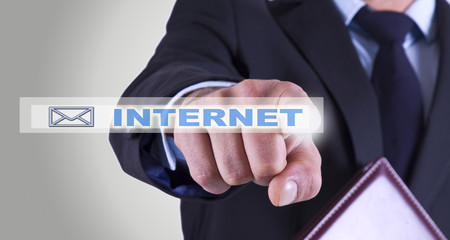businessman pressing internet button