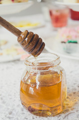 Fototapeta na wymiar Honey drip in jar