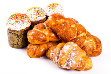 pile of fresh and delicious kroissants and rolls on a white back