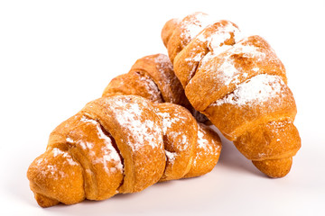 pile of fresh and delicious kroissants and rolls on a white back