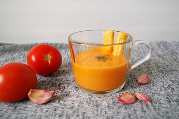 Refreshing appetizer: salmorejo on grey background