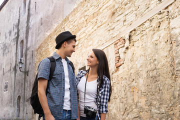 Obraz na płótnie Canvas Beautiful, smiling couple having a pleasant walk in old town
