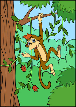 Little cute monkey hangs on the tree..