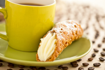 cropped image of a coffee cup with bread