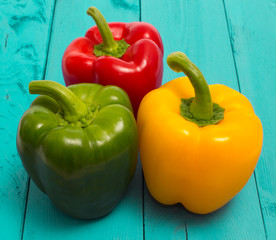 Fresh red, green and yellow peppers