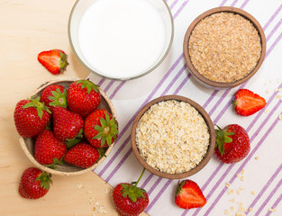 Oatmeal and strawberries on the table