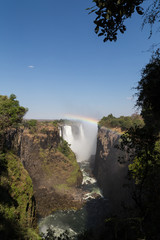 Victoria Falls in October with rainbow crossing