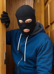 Thief entering the private property.