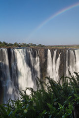 Victoria Falls in October with rainbow crossing