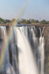 Victoria Falls in October with rainbow crossing