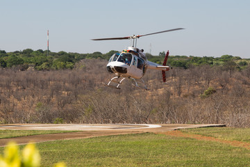 Helicopter landing at Victoria Falls