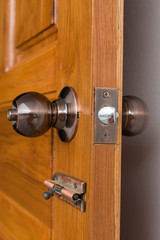 door knob and keyhole on wooden door