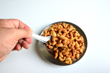 Roasted cashew nuts in spoon