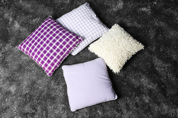 Decorative pillows on grey background