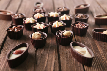 Chocolate sweets on wooden background