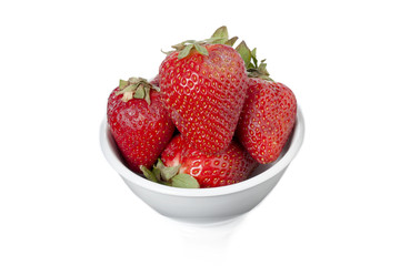 close up image of strawberries on white bowl