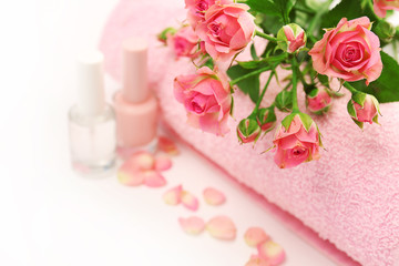 Obraz na płótnie Canvas Spa concept. Flower bouquet and towel on white background