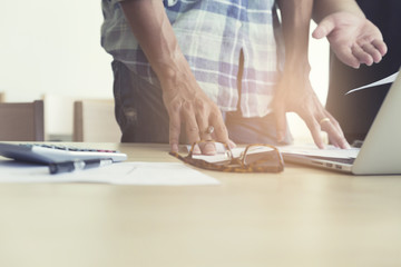 Fototapeta premium men working with calculator, business document and computer note