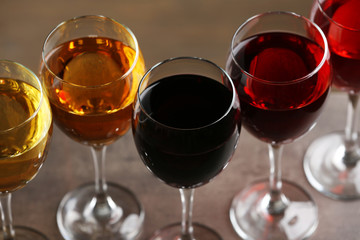 Glasses with wines of different colors on a table