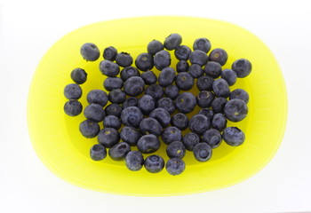 Blueberries on yellow plate