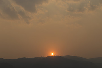 sunset on mountain hill