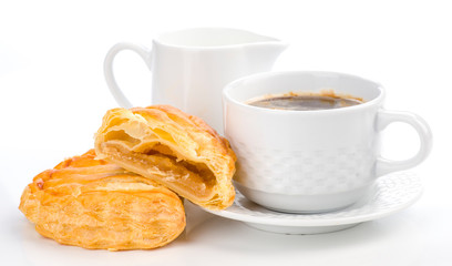 cup of coffee and milk with fresh stuffed pasta